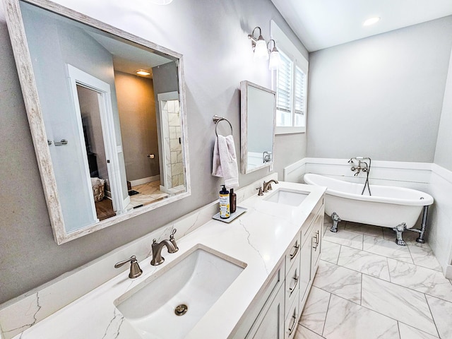 bathroom featuring a bathing tub and vanity