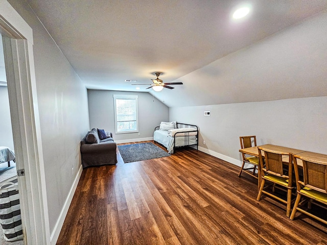 bedroom featuring vaulted ceiling, ceiling fan, and dark hardwood / wood-style floors