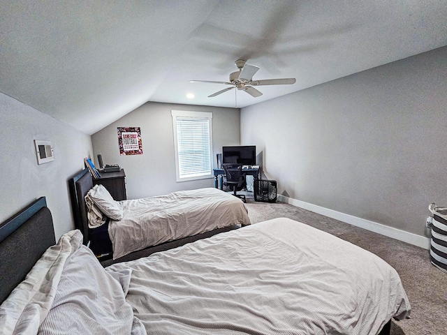 bedroom with vaulted ceiling, ceiling fan, a textured ceiling, and carpet floors