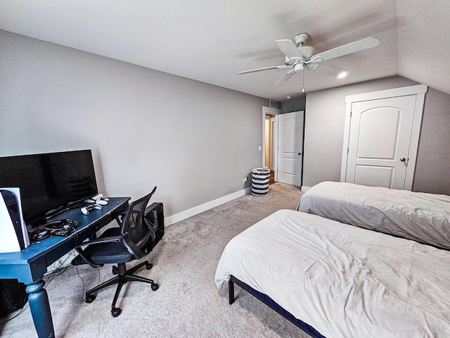 carpeted bedroom with ceiling fan and lofted ceiling