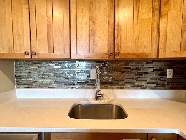 kitchen with sink and backsplash