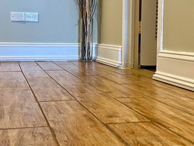 spare room featuring hardwood / wood-style flooring