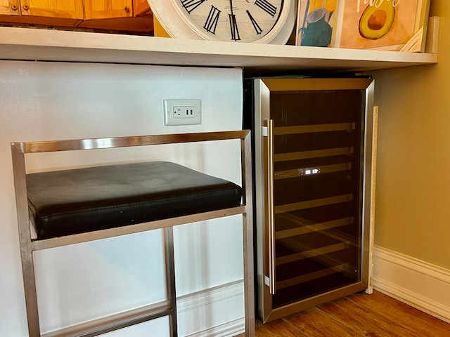 room details with wine cooler and hardwood / wood-style floors