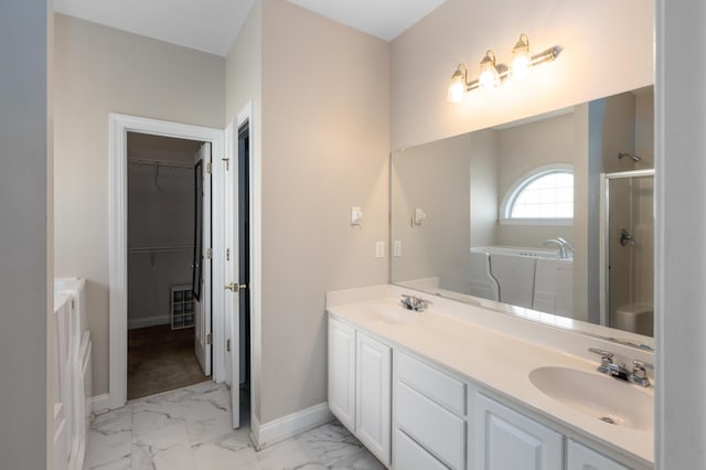 bathroom with vanity and an enclosed shower