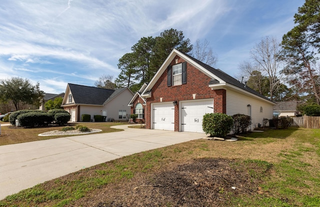 view of front of property with a front lawn and a garage