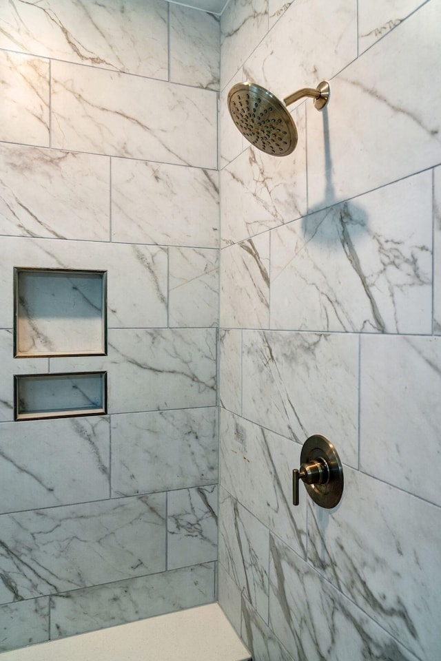 bathroom featuring tiled shower