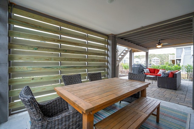 view of patio / terrace with ceiling fan, a grill, and an outdoor living space