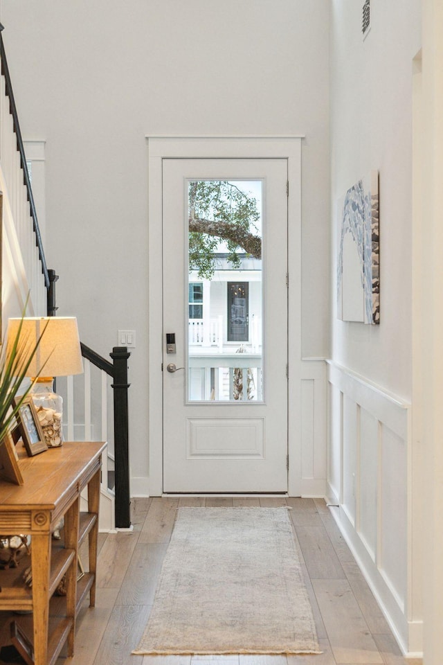 doorway with light hardwood / wood-style flooring