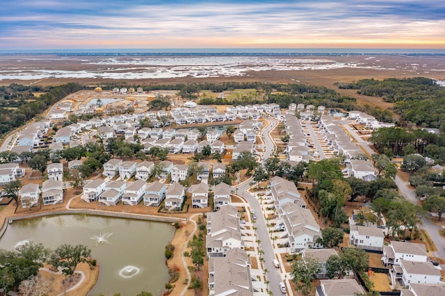 aerial view at dusk with a water view