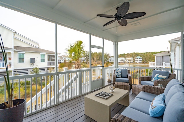 sunroom with ceiling fan