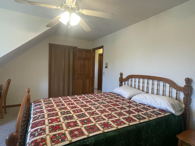 bedroom with carpet, ceiling fan, and lofted ceiling