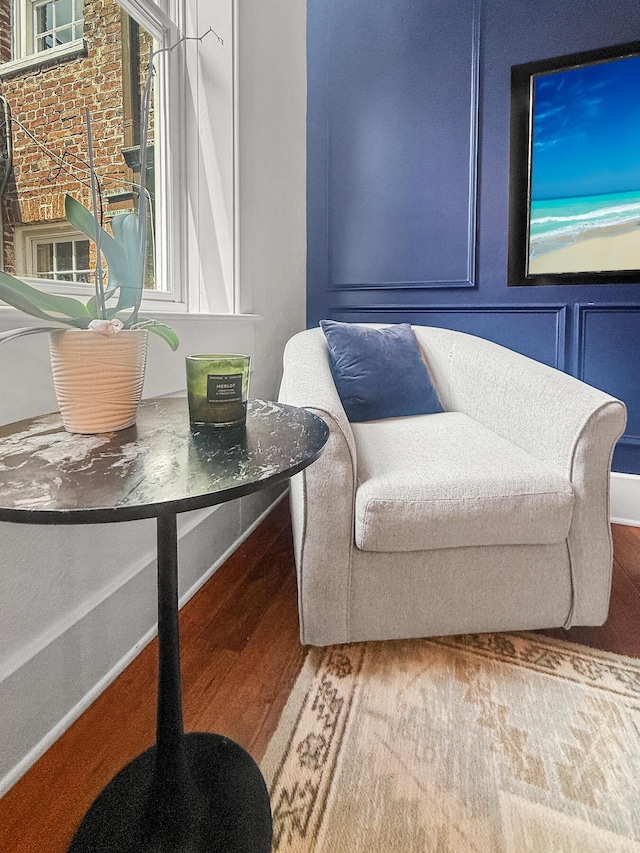 4 Beaufain St Unit 207, Charleston, SC 29401 - living area featuring wood finished floors and baseboards
