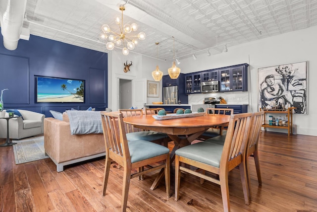 4 Beaufain St Unit 207, Charleston, SC 29401 - dining space with hardwood / wood-style floors, an ornate ceiling, and a chandelier