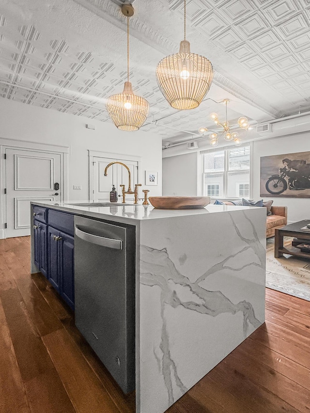 4 Beaufain St Unit 207, Charleston, SC 29401 - kitchen with blue cabinets, dishwasher, dark wood-type flooring, an ornate ceiling, and a chandelier