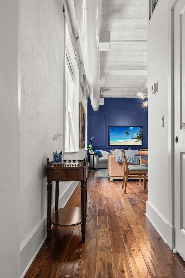 4 Beaufain St Unit 207, Charleston, SC 29401 - hallway with wood-type flooring and a textured wall
