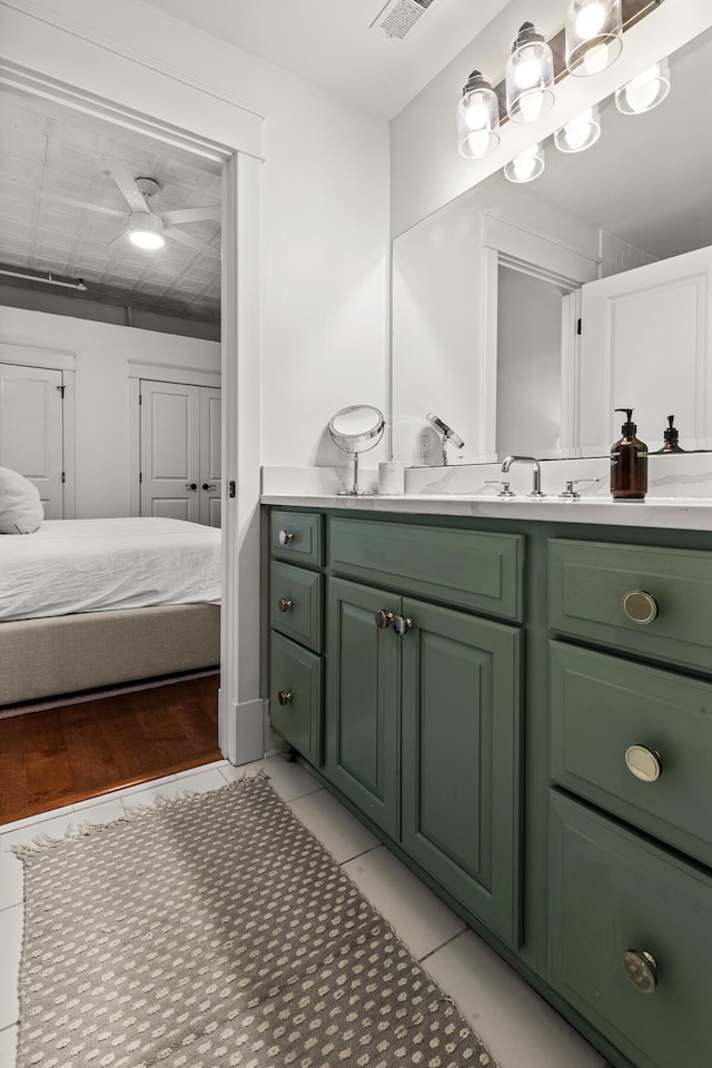 4 Beaufain St Unit 207, Charleston, SC 29401 - bathroom with vanity, ensuite bath, ceiling fan, and tile patterned flooring
