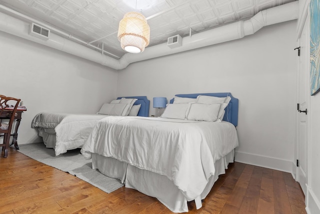 4 Beaufain St Unit 207, Charleston, SC 29401 - bedroom with hardwood / wood-style floors and an ornate ceiling