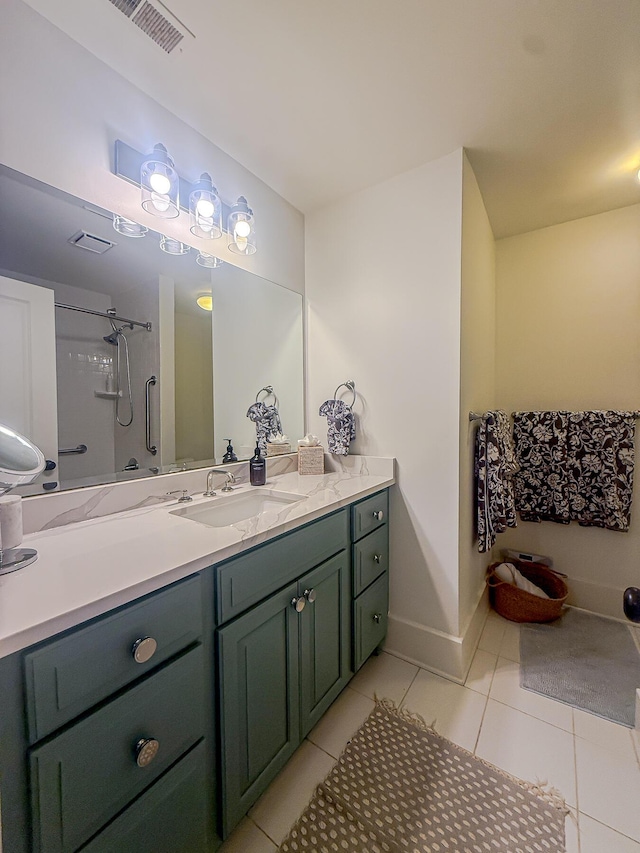 4 Beaufain St Unit 207, Charleston, SC 29401 - bathroom with vanity, a shower, and tile patterned flooring