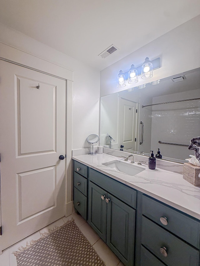 4 Beaufain St Unit 207, Charleston, SC 29401 - bathroom with vanity and tile patterned floors