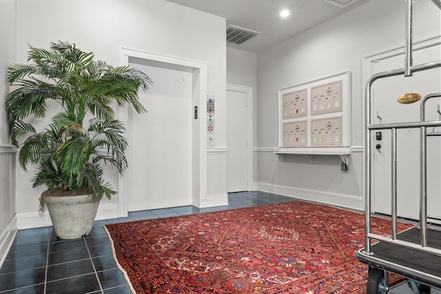 4 Beaufain St Unit 207, Charleston, SC 29401 - foyer entrance featuring dark tile patterned flooring and recessed lighting