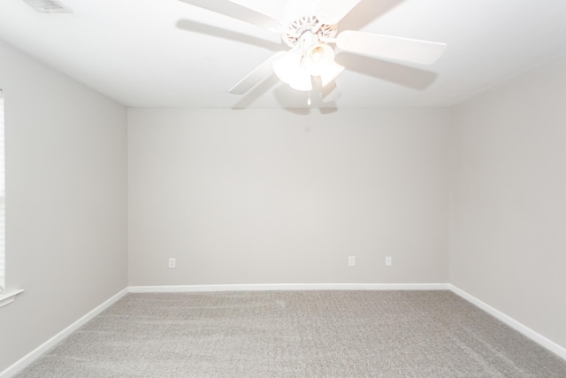 unfurnished room with baseboards, carpet, and a ceiling fan