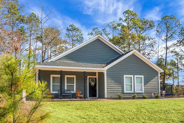 view of front of property with a front lawn and covered porch