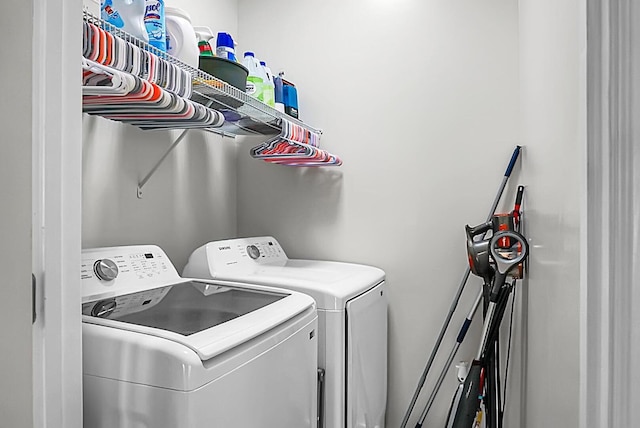 clothes washing area featuring washing machine and dryer