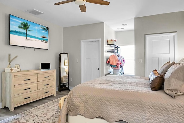 bedroom with hardwood / wood-style flooring and ceiling fan