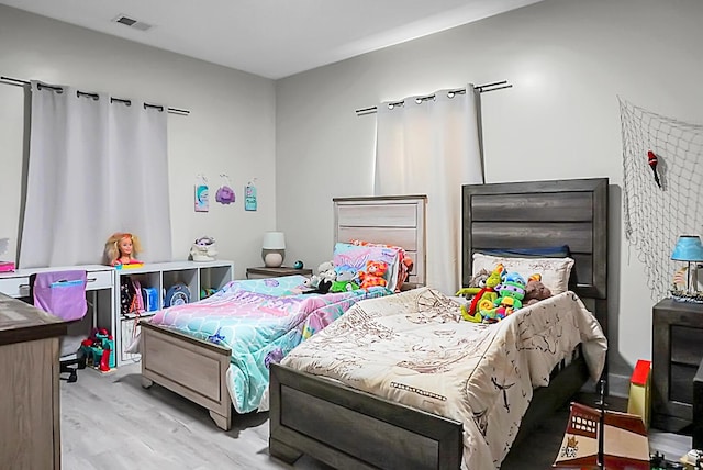 bedroom with light hardwood / wood-style floors