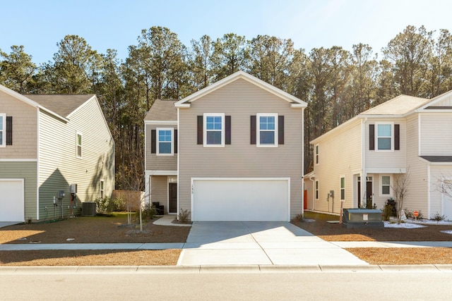 view of front of property featuring central air condition unit and a garage