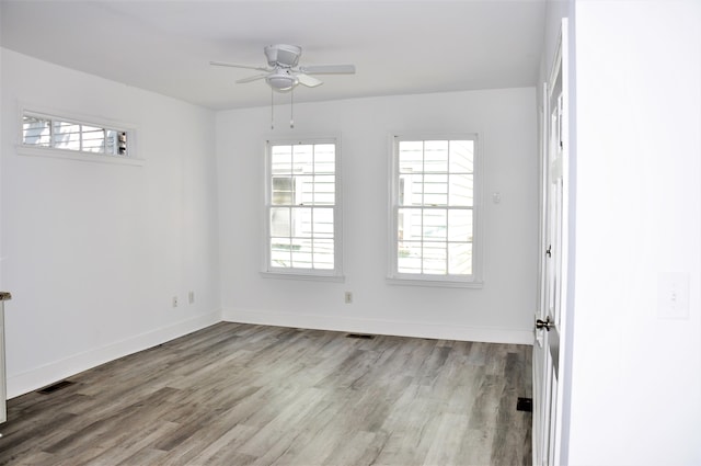 unfurnished room featuring ceiling fan and light wood-type flooring