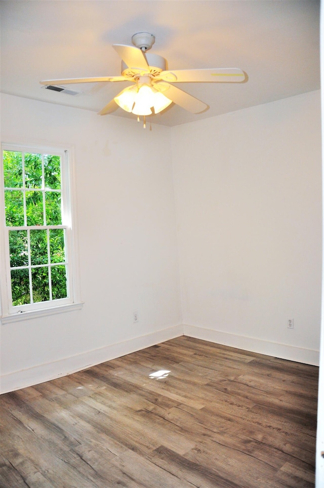 unfurnished room featuring ceiling fan and hardwood / wood-style floors