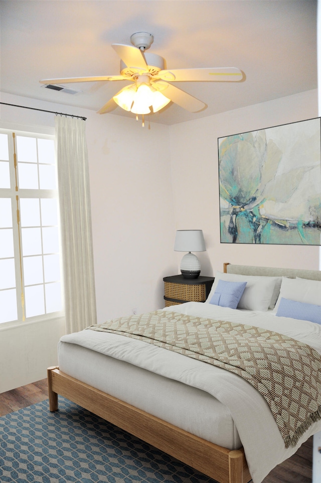 bedroom featuring ceiling fan and wood-type flooring