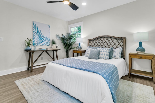 bedroom featuring ceiling fan and dark hardwood / wood-style flooring