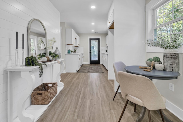 entryway with light hardwood / wood-style floors