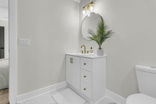 bathroom with vanity and toilet