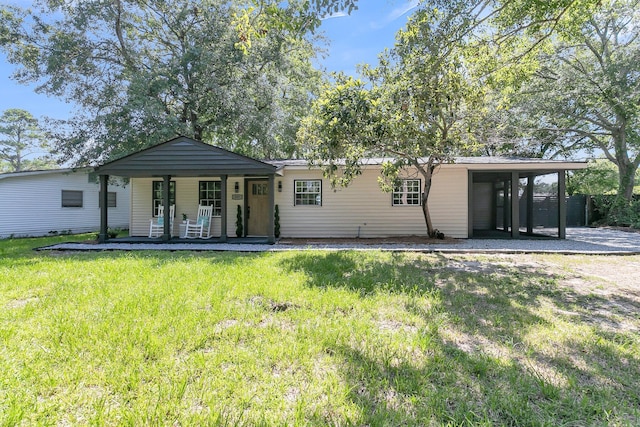 single story home featuring a front lawn and covered porch