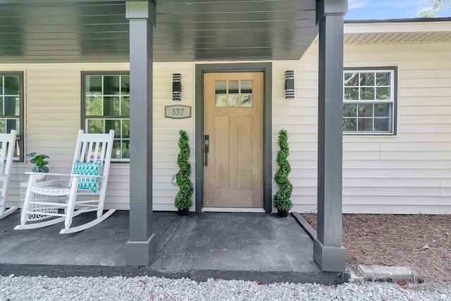 property entrance featuring covered porch