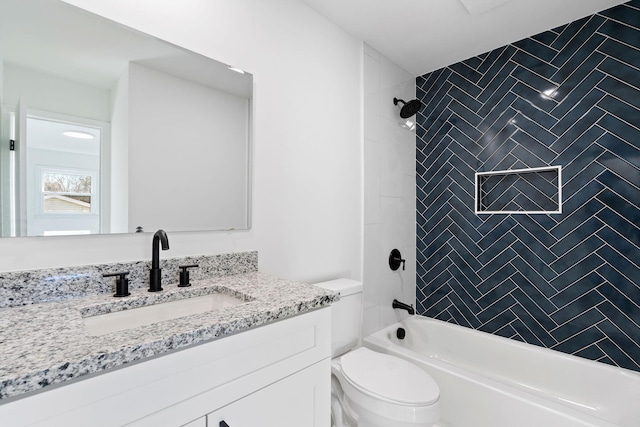 full bathroom with vanity, toilet, and tiled shower / bath combo