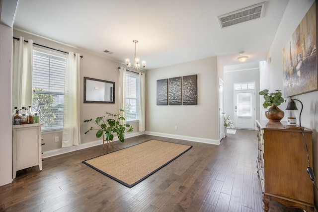 106 Sago Ct, Summerville, SC 29486 - foyer entrance with dark wood finished floors, a chandelier, and baseboards