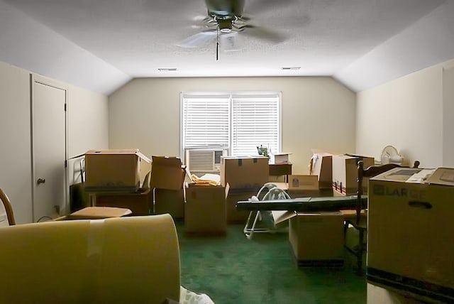 bonus room with vaulted ceiling, carpet flooring, cooling unit, and ceiling fan