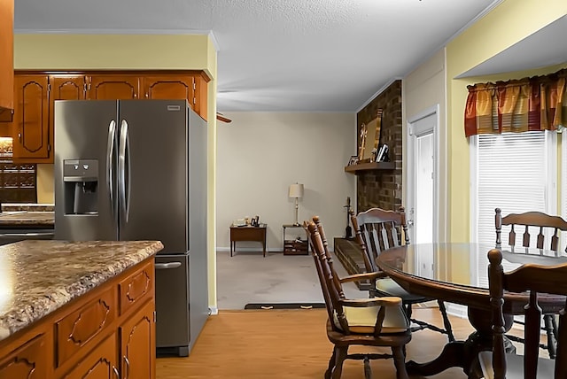 kitchen featuring stainless steel fridge with ice dispenser