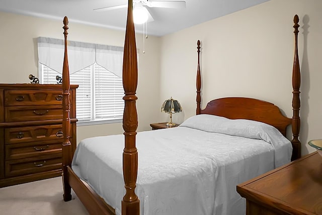 bedroom with light colored carpet and ceiling fan