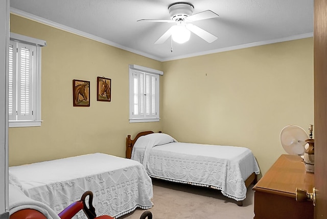 bedroom featuring crown molding, ceiling fan, carpet, and multiple windows