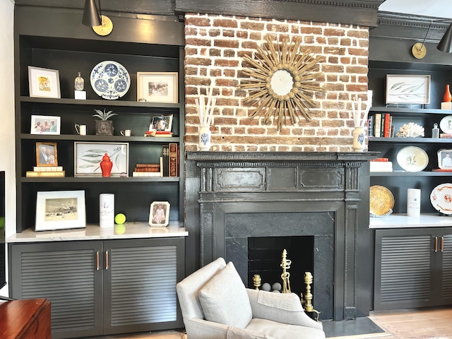 details featuring built in shelves and a fireplace