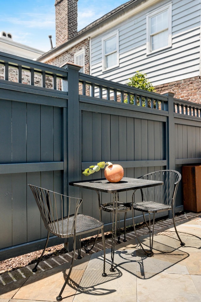 view of patio / terrace featuring fence