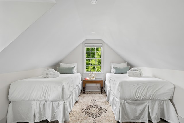 bedroom with lofted ceiling