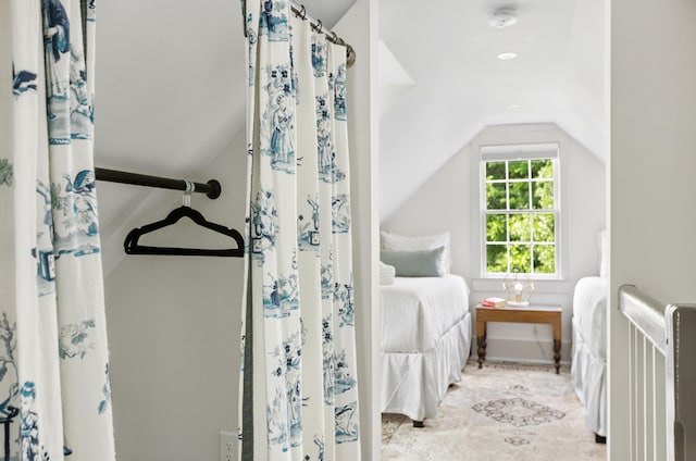 bedroom with lofted ceiling