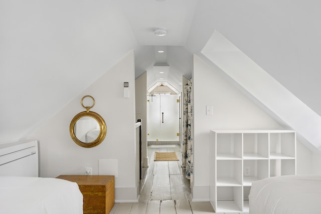 bedroom featuring lofted ceiling