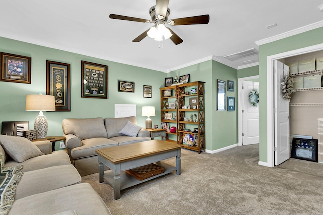 living room with crown molding, ceiling fan, and light carpet